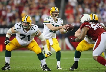 GLENDALE, AZ - JANUARY 10:  Quarterback Aaron Rodgers #12 of the Green Bay Packers snaps the ball during the 2010 NFC wild-card playoff game against the Arizona Cardinals at the Universtity of Phoenix Stadium on January 10, 2010 in Glendale, Arizona.  The