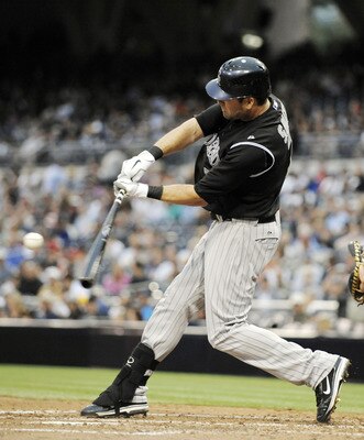 SAN DIEGO, CA - JULY 29:  Seth Smith #7 of the Colorado Rockies connects for a single in the second inning of a baseball game against the San Diego Padres at Petco Park on July 29, 2011 in San Diego, California.  (Photo by Denis Poroy/Getty Images)