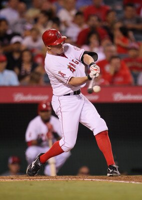 ANAHEIM, CA - AUGUST 18:  Peter Bourjos #25 of the Los Angeles Angels of Anaheim hits a single against the Texas Rangers in the second inning at Angel Stadium of Anaheim on August 18, 2011 in Anaheim, California.  (Photo by Jeff Gross/Getty Images)