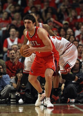 CHICAGO, IL - MAY 02:  Zaza Pachulia #27 of the Atlanta Hawks passes the ball against the Chicago Bulls in Game One of the Eastern Conference Semifinals in the 2011 NBA Playoffs at the United Center on May 2, 2011 in Chicago, Illinois. The Hawks defeated