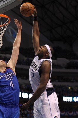 DALLAS, TX - MAY 25:  Brendan Haywood #33 of the Dallas Mavericks dunks the ball over Nick Collison #4 of the Oklahoma City Thunder in the second quarter in Game Five of the Western Conference Finals during the 2011 NBA Playoffs at American Airlines Cente