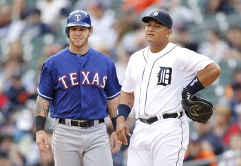 DETROIT, MI - APRIL 11:  Miguel Cabrera #24 of the Detroit Tigers stands on first base with Josh Hamilton #32 of the Texas Rangers during the seventh inning at Comerica Park on April 11, 2011 in Detroit, Michigan. Texas won the game 2-0.  (Photo by Gregor