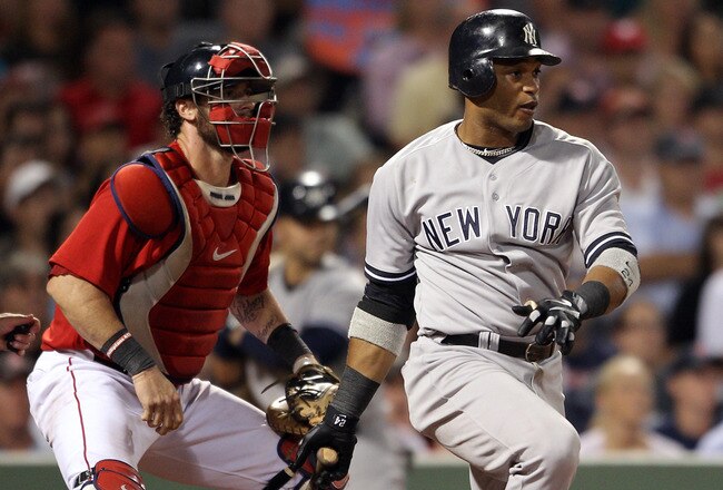 BOSTON, MA - AUGUST 05:  Robinson Cano #24 of the New York Yankees hits into a double play but Derek Jeter of the Yankees scores as Jarrod Saltalamacchia #39 of the Boston Red Sox defends on August 5, 2011 at Fenway Park in Boston, Massachusetts.  (Photo