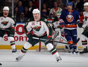 UNIONDALE, NY - MARCH 02:  John Madden #11 of the Minnesota Wild skates against the New York Islanders at the Nassau Coliseum on March 2, 2011 in Uniondale, New York. The Islanders defeated the Wild 4-1.  (Photo by Bruce Bennett/Getty Images)