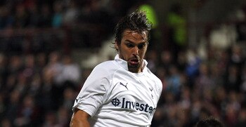 EDINBURGH, SCOTLAND - AUGUST 18:  Ian Black (#12) of Hearts battle for the ball with Niko Kranjcar of Tottenham during the UEFA Europa League Playoff first leg match between Heart of Midlothian FC and Tottenham Hotspur FC at Tynecastle Stadium on August 1