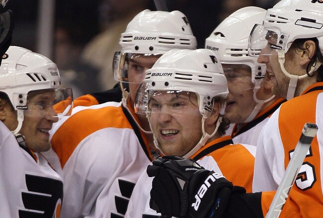 BOSTON, MA - DECEMBER 11:  James van Riemsdyk #21 of the Philadelphia Flyers is congratulated by teammates Claude Giroux #28 and Braydon Coburn #5 in the second period against the Boston Bruins on December 11, 2010 at the TD Garden in Boston, Massachusett