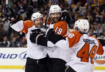 BOSTON - MAY 10:  Scott Hartnell #19 of the Philadelphia Flyers is congratulated by teammates Kimmo Timonen #44 and Danny Briere #48 after Hartnell scored in the second period against the Boston Bruins in Game Five of the Eastern Conference Semifinals dur