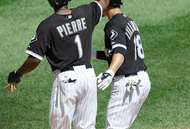 CHICAGO, IL- AUGUST  21: Brent Lillibridge #18 of the Chicago White Sox is congratulated by Juan Pierre #1 after hitting a home run against the Texas Rangers at U.S. Cellular Field on August 21, 2011 in Chicago, Illinois. (Photo by Scott Boehm/Getty Image