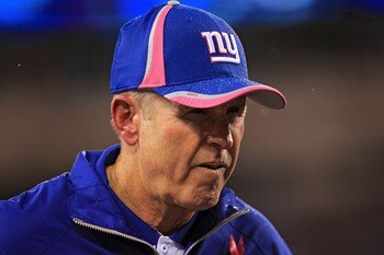 EAST RUTHERFORD, NJ - OCTOBER 03:  Head coach Tom Coughlin of the New York Giants runs off the field at the end of the first half against the Chicago Bears at New Meadowlands Stadium on October 3, 2010 in East Rutherford, New Jersey.  (Photo by Chris McGr
