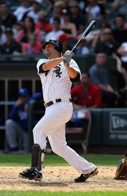 CHICAGO, IL - AUGUST 14: Paul Konerko #14 of the Chicago White Sox gets one of his three hits against the Kansas City Royals at U.S. Cellular Field on August 14, 2011 in Chicago, Illinois. The White Sox defeated the Royals 6-2. (Photo by Jonathan Daniel/G
