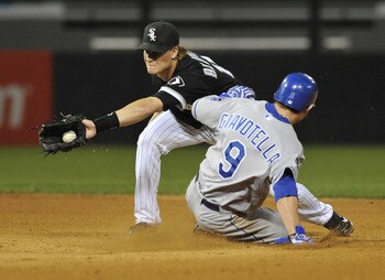 CHICAGO, IL - AUGUST 12: Johnny Giavotella #9 of the Kansas City Royals steals second base as Gordon Beckham #15 of the Chicago White Sox makes the tag in the eighth inning on August 12, 2011 at U.S. Cellular Field in Chicago, Illinois.  (Photo by David B