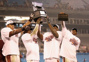 CHARLOTTE, NC - DECEMBER 04:  Teammates Andre Smith #88, Tyrod Taylor #5, John Graves #91 and Davon Morgan #2 of the Virginia Tech Hokies celebrate after winning the ACC Championship 44-33 after their game at Bank of America Stadium on December 4, 2010 in