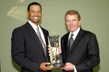 UNITED STATES - MARCH 15:  Tiger Woods receives the Mark H. McCormack Award from PGA Tour Commissioner Tim Finchem at Bay Hill Club and Lodge in Orlando Florida on Tuesday March 14, 2006.  (Photo by Gary Bassing/Getty Images)