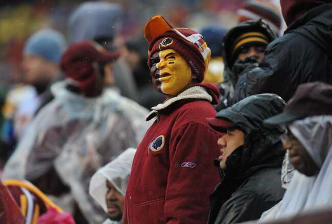 LANDOVER, MD - DECEMBER 12:  A fan of the Washington Redskins watches the game against the Tampa Bay Buccaneers  at FedExField on December 12, 2010 in Landover, Maryland. The Buccaneers defeated the Redskins 17-16. (Photo by Larry French/Getty Images)