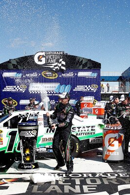 BROOKLYN, MI - AUGUST 21:  Kyle Busch, driver of the #18 Interstate Batteries Toyota, celebrates in Victory Lane after winning the NASCAR Sprint Cup Series Pure Michigan 400 at Michigan International Speedway on August 21, 2011 in Brooklyn, Michigan.  (Ph