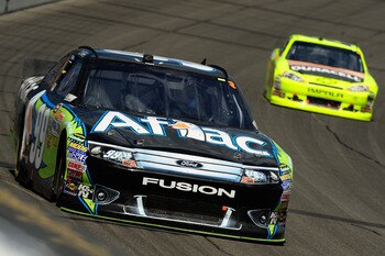 BROOKLYN, MI - AUGUST 21:  Carl Edwards, driver of the #99 Aflac Ford, leads Paul Menard, driver of the #27 Duracell/Menards Chevrolet, during the NASCAR Sprint Cup Series Pure Michigan 400 at Michigan International Speedway on August 21, 2011 in Brooklyn
