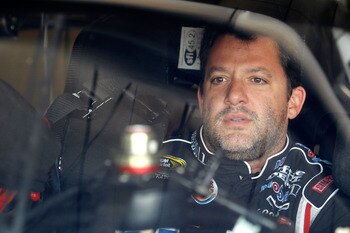 BROOKLYN, MI - AUGUST 20:  Tony Stewart, driver of the #14 Mobil 1/Office Depot Chevrolet, waits to start practice for the NASCAR Sprint Cup Series Pure Michigan 400 at Michigan International Speedway on August 20, 2011 in Brooklyn, Michigan.  (Photo by T
