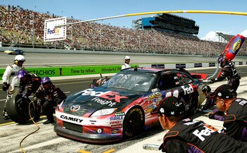 BROOKLYN, MI - AUGUST 21: Denny Hamlin, driver of the #11 FedEx Freight Toyota, comes in for a pit stop during the NASCAR Sprint Cup Series Pure Michigan 400 at Michigan International Speedway on August 21, 2011 in Brooklyn, Michigan.  (Photo by Jeff Zele