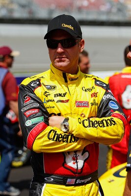BROOKLYN, MI - AUGUST 21:  Clint Bowyer, driver of the #33 Cheerios/Hamburger Helper Chevrolet, stands on the grid prior to the NASCAR Sprint Cup Series Pure Michigan 400 at Michigan International Speedway on August 21, 2011 in Brooklyn, Michigan.  (Photo