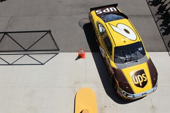 BROOKLYN, MI - AUGUST 19:  David Ragan drives the #6 UPS Ford through the garage area during practice for the NASCAR Sprint Cup Series Pure Michigan 400 at Michigan International Speedway on August 19, 2011 in Brooklyn, Michigan.  (Photo by Jamie Squire/G