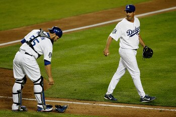 LOS ANGELES, CA - OCTOBER 15:  Pitcher Greg Maddux #36 of the Los Angeles Dodgers reacts towards catcher Russell Martin #55 after a run scored in the fifth inning against the Philadelphia Phillies in Game Five of the National League Championship Series du