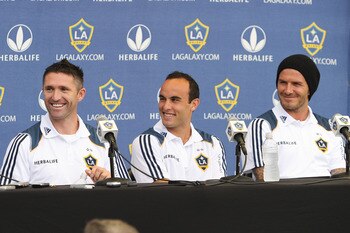CARSON, CA - AUGUST 19:  (L-R) Newly acquired Los Angeles Galaxy forward Robbie Keane #14, Landon Donovan #10, and David Beckham #23 react during a news conference at The Home Depot Center on August 19, 2011 in Carson, California. Keane, who is the captai
