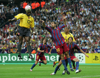 PARIS - MAY 17:  Sol Campbell (R) of Arsenal rises above Presas Oleguer of Barcelona to score the first goal  during the UEFA Champions League Final between Arsenal and Barcelona at the Stade de France on May 17, 2006 in Paris, France.  (Photo by Laurence