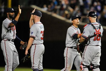 CHICAGO, IL - AUGUST 22:The Atlanta Braves celebrate their victory against the Chicago Cubs on August 22, 2011 at Wrigley Field in Chicago, Illinois. The Braves defeated the Cubs 3-0.  (Photo by David Banks/Getty Images)