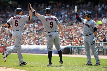 DETROIT - AUGUST 21: Lou Marson #6 and Jack Hannahan #9 of the Cleveland Indians celebrate with Shin-Soo Choo #17 after scoring on Michael Brantley #23 double to deep right field in the fourth inning during the game against the Detroit Tigers at Comerica