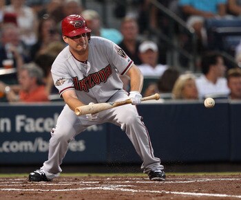 ATLANTA, GA - AUGUST 19:  Pitcher Daniel Hudson #41 of the Arizona Diamondbacks lays a bunt down during the game against the Atlanta Braves at Turner Field on August 19, 2011 in Atlanta, Georgia.  (Photo by Mike Zarrilli/Getty Images)