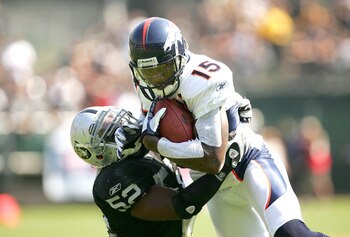 OAKLAND, CA - SEPTEMBER 27:  Brandon Marshall #15 of the Denver Broncos is tackled by Kirk Morrison #52 of the Oakland Raiders at the Oakland-Alameda County Coliseum on September 27, 2009 in Oakland, California.  (Photo by Ezra Shaw/Getty Images)