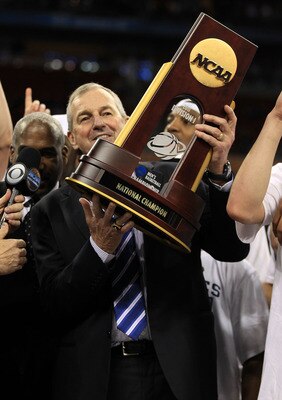 HOUSTON, TX - APRIL 04:  Head coach Jim Calhoun of the Connecticut Huskies celebrate with his team and the trophy after defeating the Butler Bulldogs to win the National Championship Game of the 2011 NCAA Division I Men's Basketball Tournament by a score