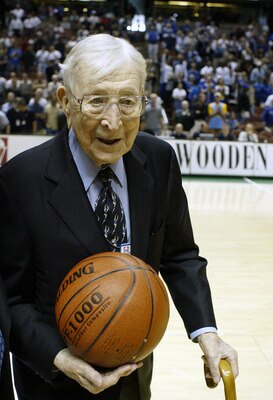 ANAHEIM, CA - DECEMBER 6:  Legendary coach John Wooden walks the court during the John R. Wooden Classic as Kentucky defeated UCLA 52-50 in the John R. Wooden Classic on December 6, 2003 at the Arrowhead Pound in Anaheim, California. (Photo by Robert Labe