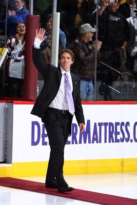 DENVER - OCTOBER 1: Joe Sakic waves to the crowd as his number is retired by the Colorado Avalanche and hoisted to the rafters in a pregame ceremony at the Pepsi Center on October 1, 2009 in Denver, Colorado. (Photo by Garrett W. Ellwood/Getty Images)