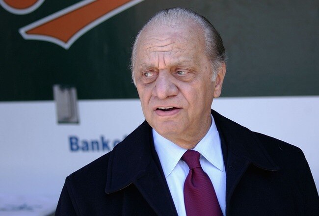 BALTIMORE - APRIL 4:  Owner Peter Angelos of the Baltimore Orioles watches pregame festivities from the duggout prior to the Baltimore Orioles defeating the Oakland Athletics 4-0 on opening day, April 4, 2005 at Oriole Park at Camden Yards in Baltimore, M