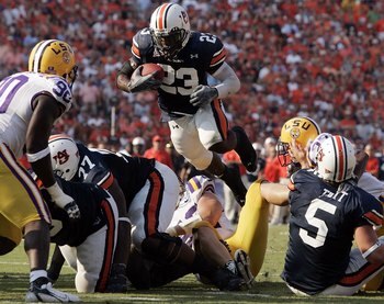 AUBURN, AL - SEPTEMBER 16:  Kenny Irons #23 of the Auburn University Tigers attempts to score a touchdown against the Louisiana State University Tigers September 16, 2006 at Jordan-Hare Stadium in Auburn, Alabama.  Auburn defeated LSU 7-3.   (Photo by Chr