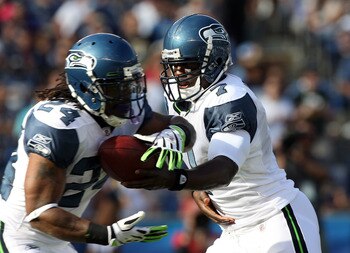 SAN DIEGO, CA - AUGUST 11:  Quarterback Tarvaris Jackson #7 of  the Seattle Seahawks gives the ball to teammate runningback Marshawn Lynch #24 against the San Diego Chargers during their  NFL preseason game on August 11, 2011 at Qualcomm Stadium in San Di