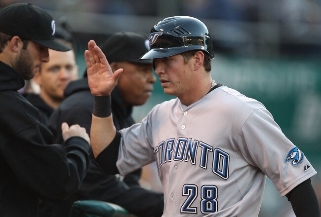 OAKLAND, CA - AUGUST 18:  Colby Rasmus #28 of the Toronto Blue Jays celebrates after scoring on a Brett Lawrie single in the second inning against the Oakland Athletics at O.co Coliseum on August 18, 2011 in Oakland, California.  (Photo by Jed Jacobsohn/G
