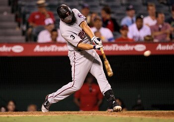 ANAHEIM, CA - AUGUST 03:  Michael Cuddyer #5 of the Minnesota Twins hits his second home run of the game, in the ninth inning against the Los Angeles Angels of Anaheim on August 3, 2011 at Angel Stadium in Anaheim, California.  (Photo by Stephen Dunn/Gett