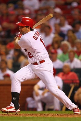 ST. LOUIS, MO - AUGUST 11: Lance Berkman #12 of the St. Louis Cardinals hits an RBI single against the Milwaukee Brewers at Busch Stadium on August 11, 2011 in St. Louis, Missouri.  (Photo by Dilip Vishwanat/Getty Images)