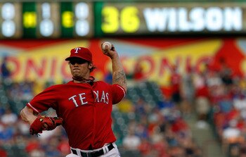 ARLINGTON, TX - AUGUST 22:  C.J. Wilson #36 of the Texas Rangers pitches against the Boston Red Sox at Rangers Ballpark in Arlington on August 22, 2011 in Arlington, Texas.  (Photo by Tom Pennington/Getty Images)