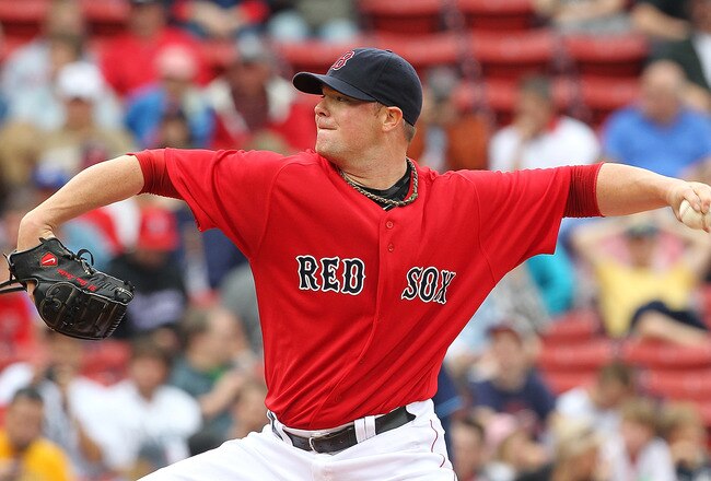 BOSTON - AUGUST 16:  Jon Lester #31 of the Boston Red Sox throws against the Tampa Bay Rays at Fenway Park on August 16, 2011 in Boston, Massachusetts.  (Photo by Jim Rogash/Getty Images)