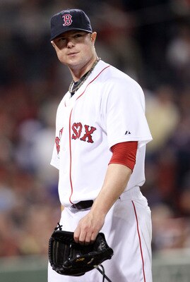 BOSTON, MA - JULY 25: Jon Lester #31 of the Boston Red Sox heads into the dugout in the sixth inning against the Kansas City Royals on July 25, 2011 at Fenway Park in Boston, Massachusetts.  (Photo by Elsa/Getty Images)