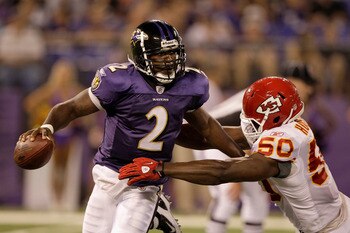 BALTIMORE, MD - AUGUST 19: Quarterback Tyrod Taylor #2 of the Baltimore Ravens is pressured by linebacker Justin Houston #50 of the Kansas City Chiefs during the second half of a preseason game at M&T Bank Stadium on August 19, 2011 in Baltimore, Maryland