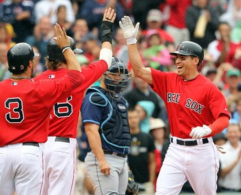 BOSTON - AUGUST 16:  Jacoby Ellsbury #2 of the Boston Red Sox celebrates with Mike Aviles #3 of the Boston Red Sox and Josh Reddick #16 of the Boston Red Sox after he hit a three-run home run against the Tampa Bay Rays in the third inning at Fenway Park o