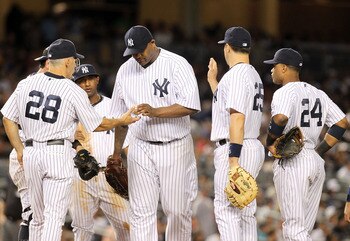 NEW YORK, NY - AUGUST 24:  CC Sabathia #52 of the New York Yankees is pulled from the game by manager Joe Girardi #28 against the Oakland Athletics on August 24, 2011 at Yankee Stadium in the Bronx borough of New York City.  (Photo by Nick Laham/Getty Ima