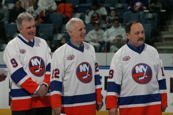 UNIONDALE, NY - MARCH 02:  (L-R) Clark Gillies, Mike Bossy and Bryan Trottier of 'The 'Core of the Four' New York Islanders Stanley Cup championships take part in a ceremony prior to the Islanders game against the Florida Panthers on March 2, 2008 at the