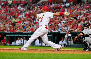 ST. LOUIS, MO - AUGUST 14: Albert Pujols #5 of the St. Louis Cardinals follows through on a two-run home run against the Colorado Rockies at Busch Stadium on August 14, 2011 in St. Louis, Missouri.  (Photo by Jeff Curry/Getty Images)