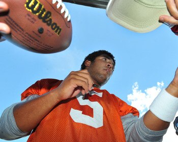 TAMPA, FL - JULY 29:  Quarterback Josh Freeman #5 of the Tampa Bay Buccaneers signs an autograph during the team's first pre-season training camp practice July 29, 2011 at One Buccaneer Place in Tampa, Florida. (Photo by Al Messerschmidt/Getty Images)