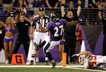 BALTIMORE, MD - AUGUST 19: Running back Ray Rice #27 of the Baltimore Ravens scores a touchdown in front of safety Sabby Piscitelli #49 of the Kansas City Chiefs during the first half of a preseason game at M&T Bank Stadium on August 19, 2011 in Baltimore